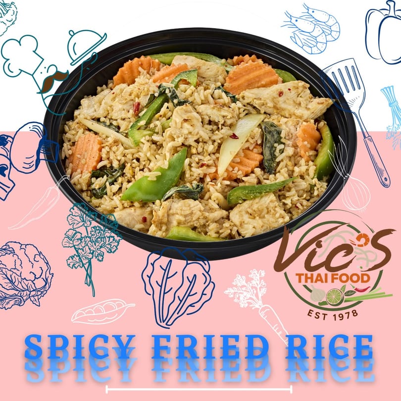 Vic's Thai Food spicy fried rice with chicken, carrots, and green beans in a black bowl.