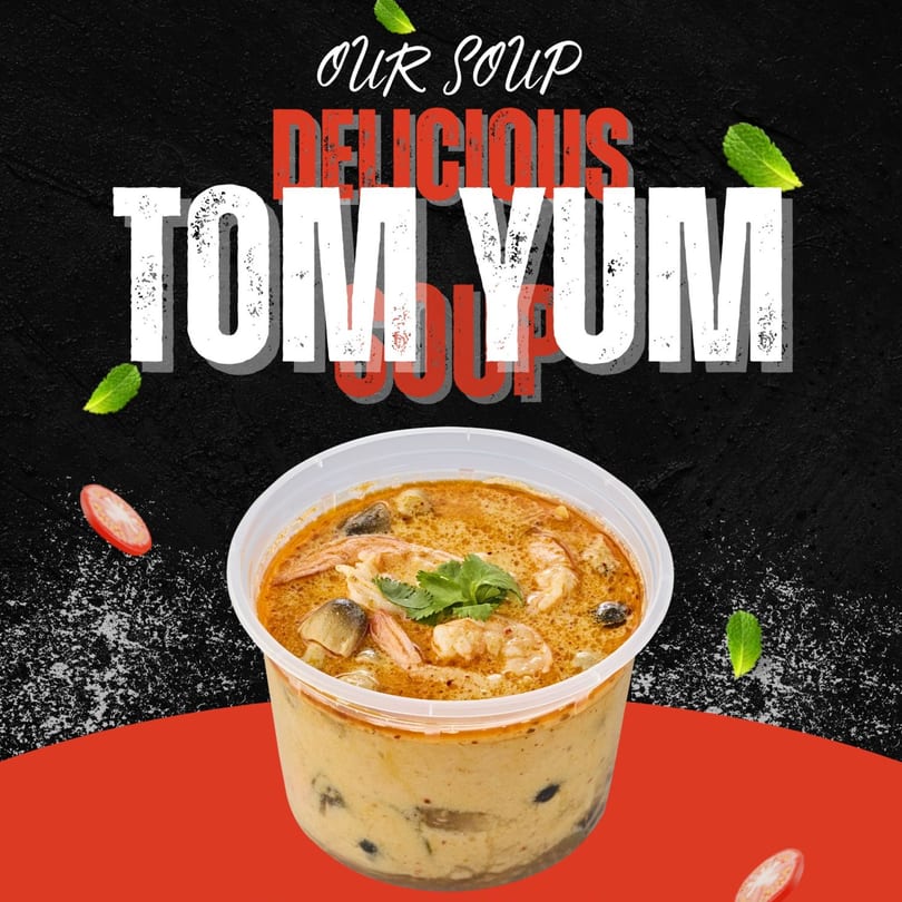 Delicious Tom Yum soup from Vic's Thai Food, with shrimp, mushrooms, and cilantro in a plastic container.
