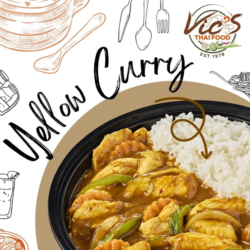 Vic's Thai Food yellow curry with chicken, vegetables, and white rice in a black bowl.